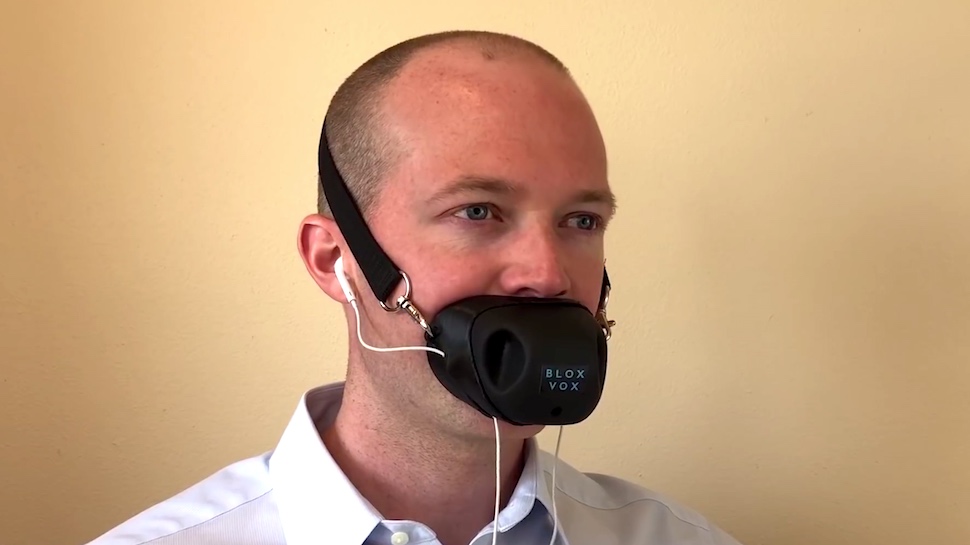 This Bizarre Device Muffles Your Phone Calls and Doubles As Bane Cosplay