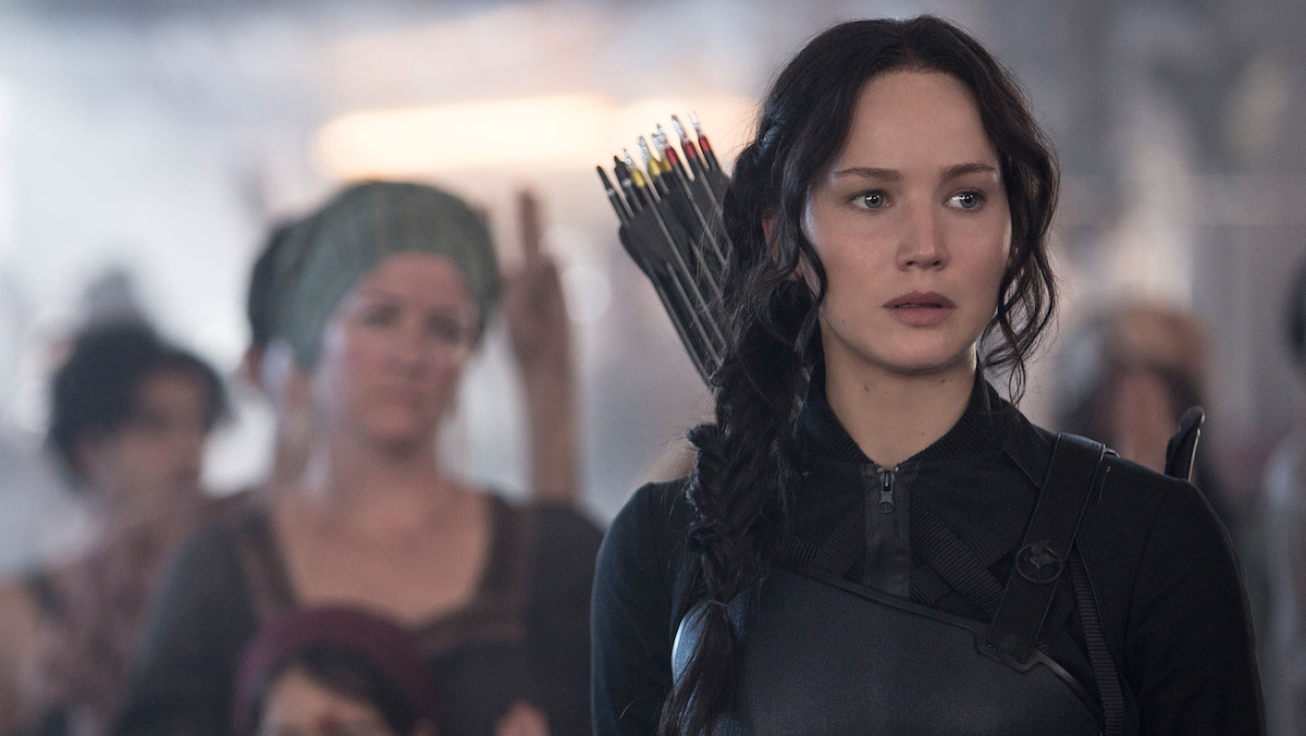 An image from the Hunger Games shows Katniss Everdeen wearing her bow and arrow