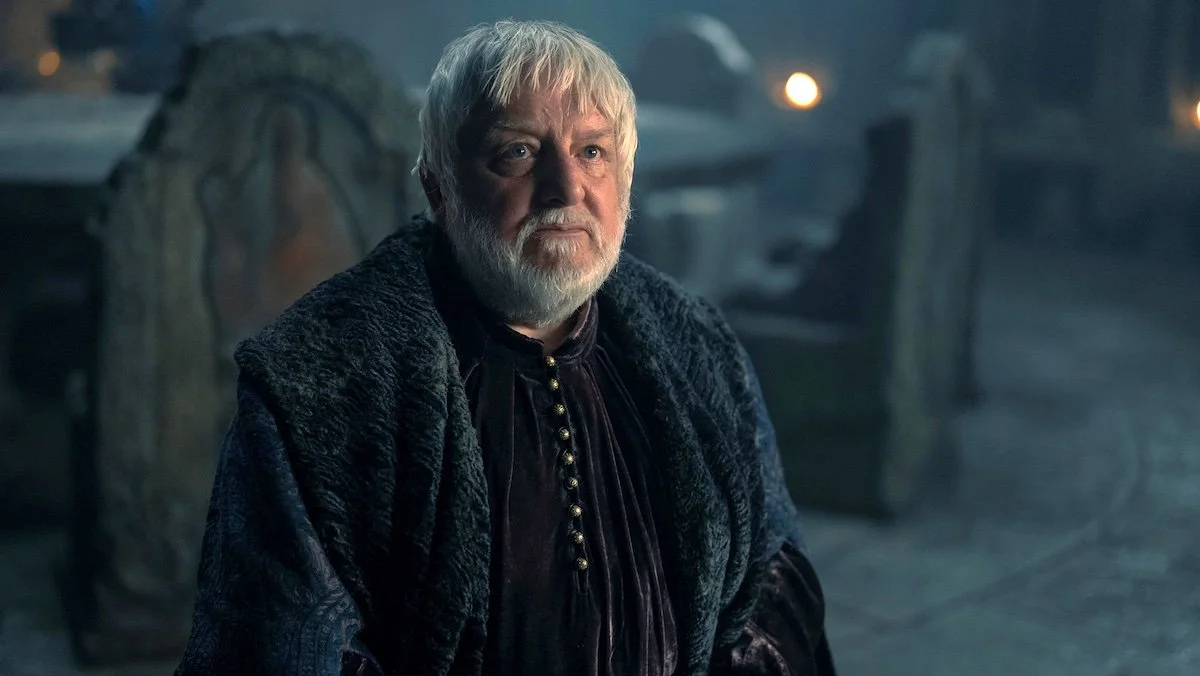 The white-haired, white-bearded Ser Simon Strong in his black robes on House of the Dragon